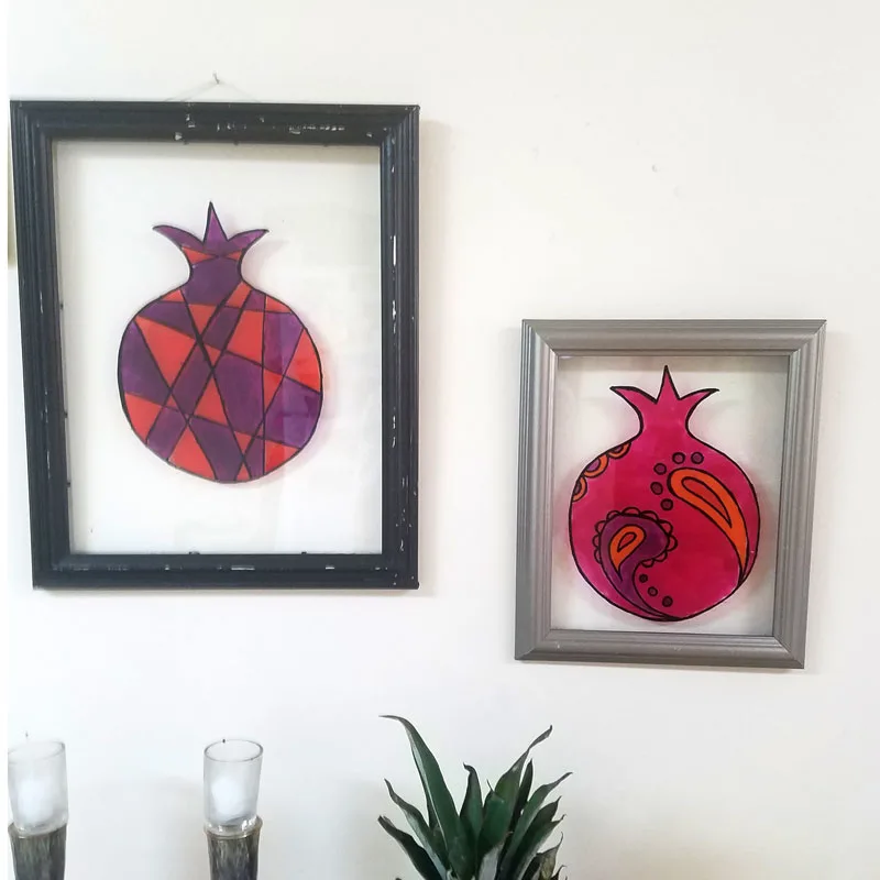 Make stained glass pomegranate wall art as a cool DIY sukkah decoration idea for teens or adults - this beautiful Judaica wall art idea is water resistant making it perfect for outdoors! You can use it for Sukkot or Sukkos, and then bring it indoors and hang it in your home year-round.