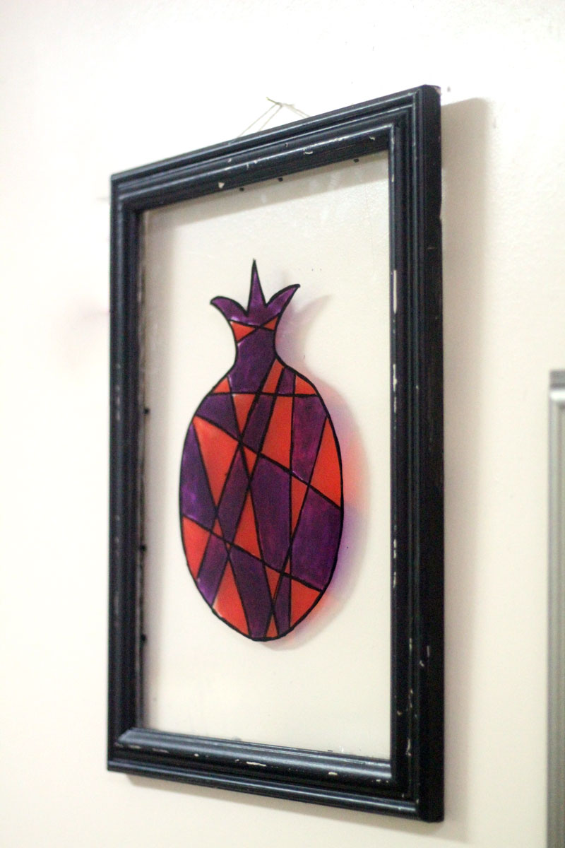 Make stained glass pomegranate wall art as a cool DIY sukkah decoration idea for teens or adults - this beautiful Judaica wall art idea is water resistant making it perfect for outdoors! You can use it for Sukkot or Sukkos, and then bring it indoors and hang it in your home year-round.