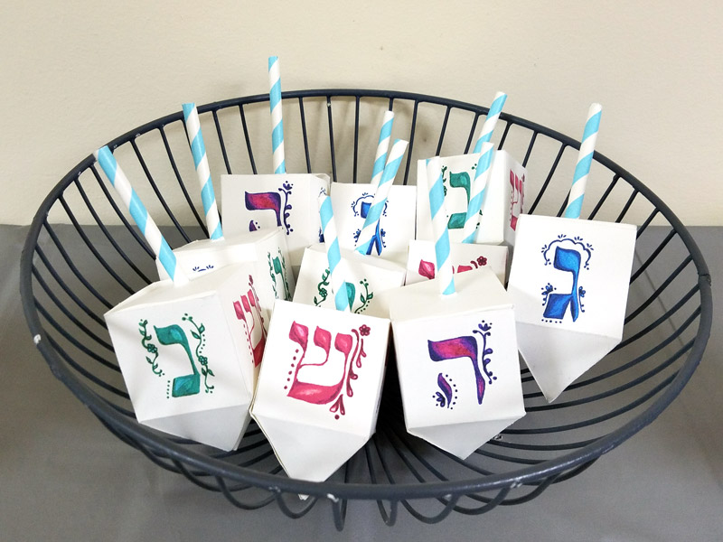 These free printable dreidel boxes are perfect for the Jewish holiday of Hanukkah or Chanukah as it's often called! It's perfect for filling with chocolate coins - or gelt- and make a great Hanukkah party favor or treat box. This Hannukah craft is great to use for small gifts too!