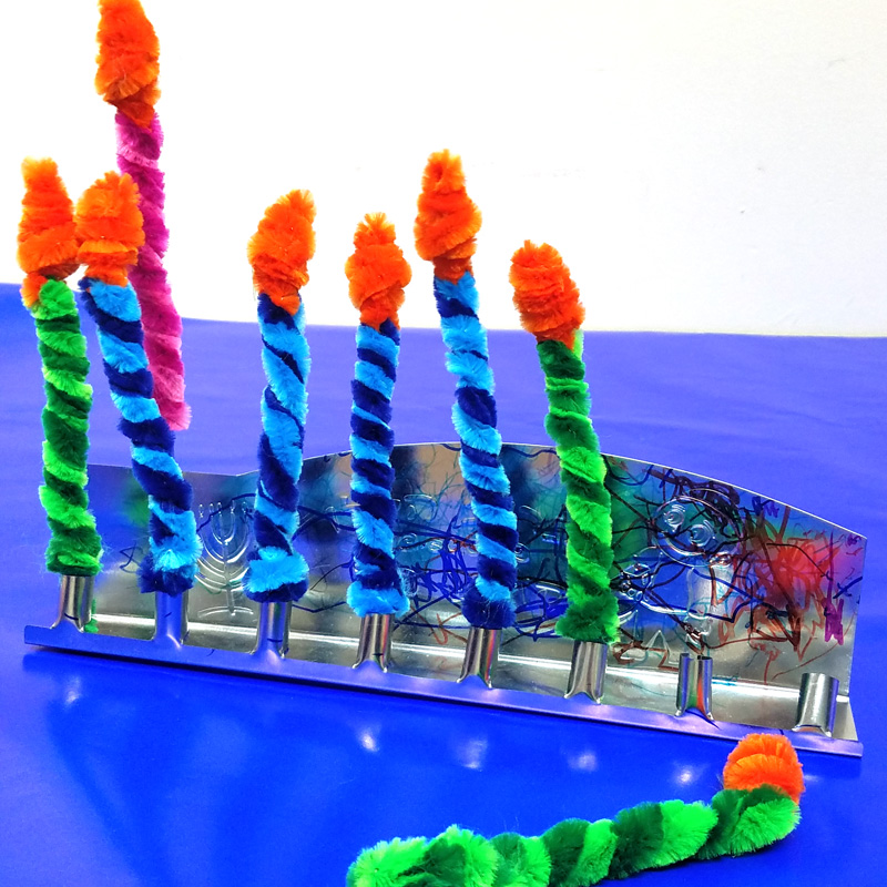 Make these Chanukah candles for kids to keep them safe when lighting the menorah! This fun Hanukkah Craft is a great way to involve your preschooler or toddler with the holiday. #Hanukkah #chanukah