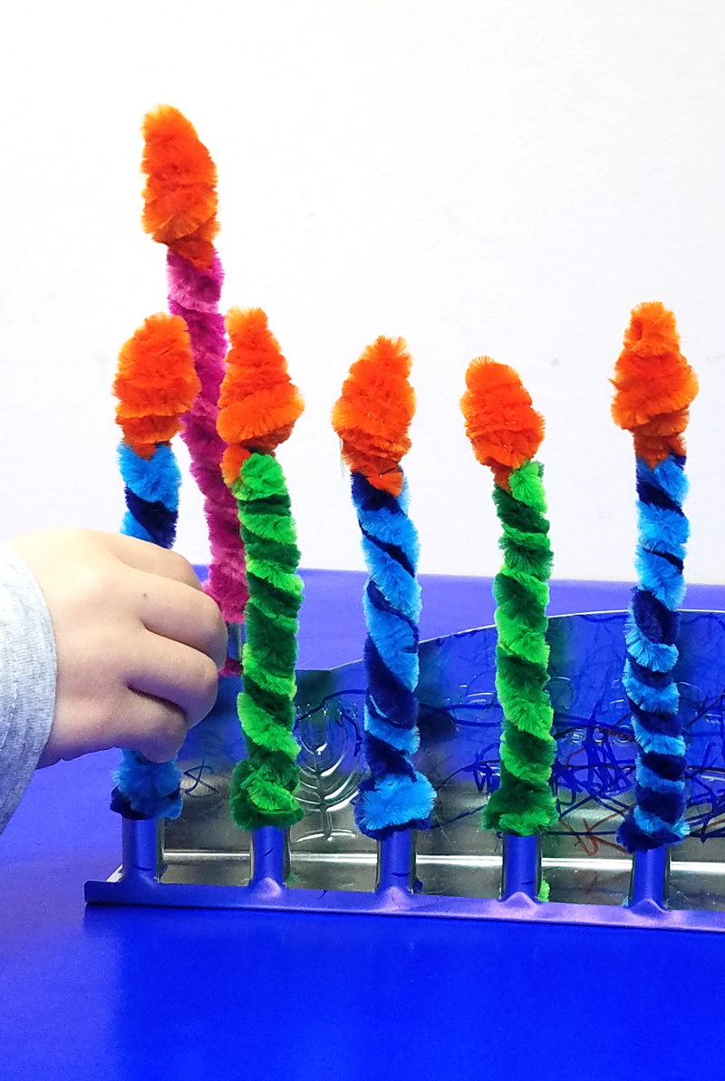 Make these Chanukah candles for kids to keep them safe when lighting the menorah! This fun Hanukkah Craft is a great way to involve your preschooler or toddler with the holiday. #Hanukkah #chanukah