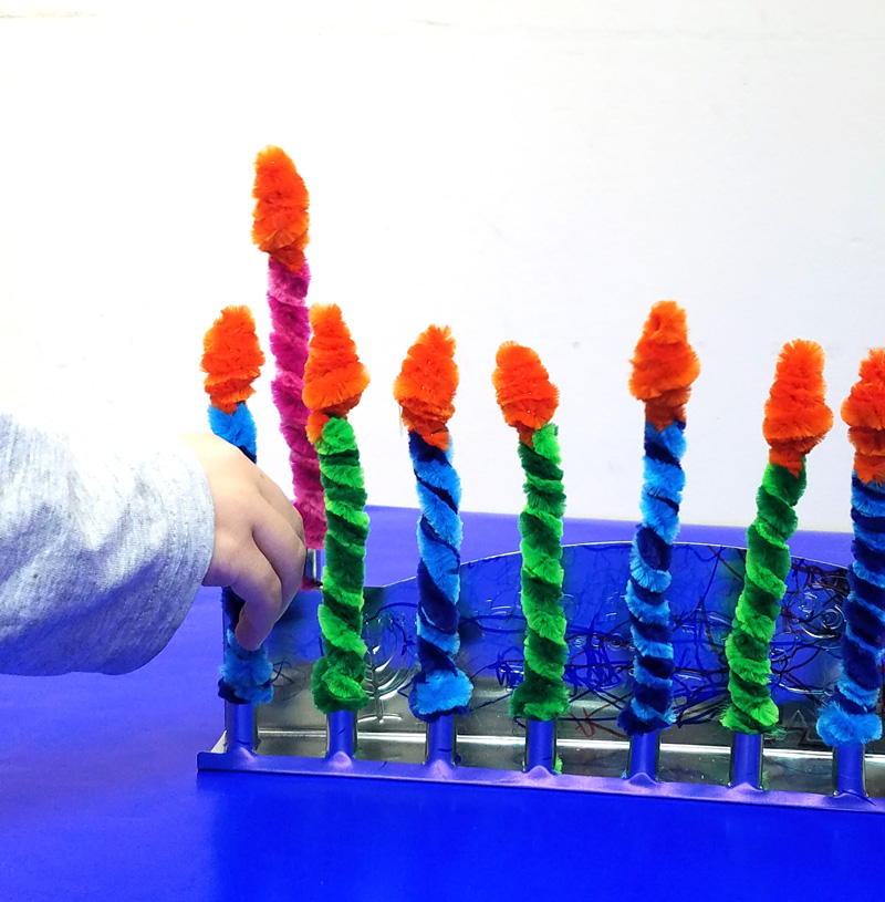 Make these Chanukah candles for kids to keep them safe when lighting the menorah! This fun Hanukkah Craft is a great way to involve your preschooler or toddler with the holiday. #Hanukkah #chanukah