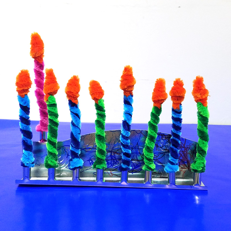 Make these Chanukah candles for kids to keep them safe when lighting the menorah! This fun Hanukkah Craft is a great way to involve your preschooler or toddler with the holiday. #Hanukkah #chanukah