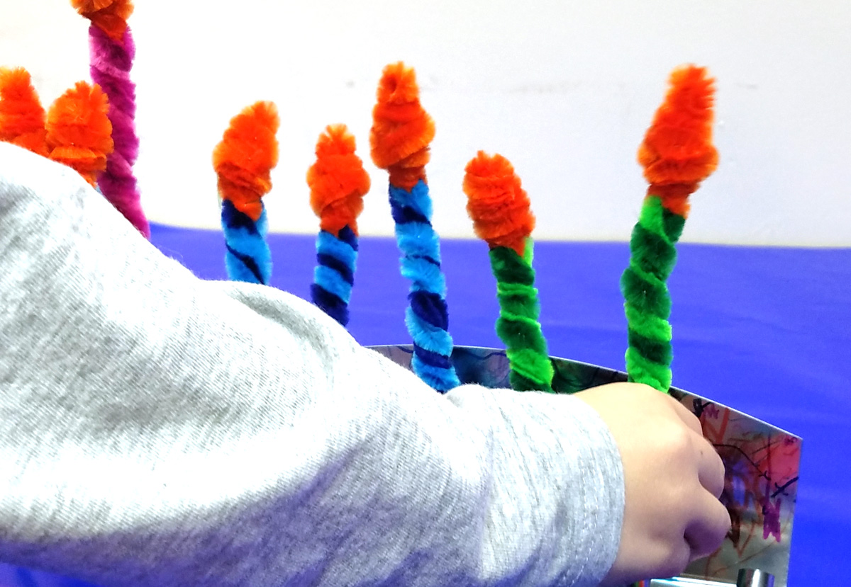 Make these Chanukah candles for kids to keep them safe when lighting the menorah! This fun Hanukkah Craft is a great way to involve your preschooler or toddler with the holiday. #Hanukkah #chanukah