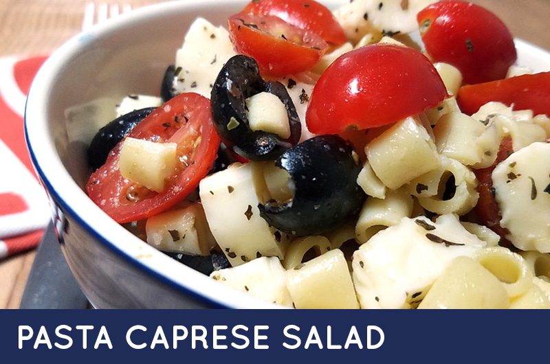 Make this delicious pasta caprese salad - a yummy pasta salad recipe that's Kosher, dairy and easy to make! It's kid-friendly and allergy safe too! #recipes #allergyfriendly #pasta #pastasalad #kidfriendly #allergysafe #kosher #kosherfood #kosherrecipe