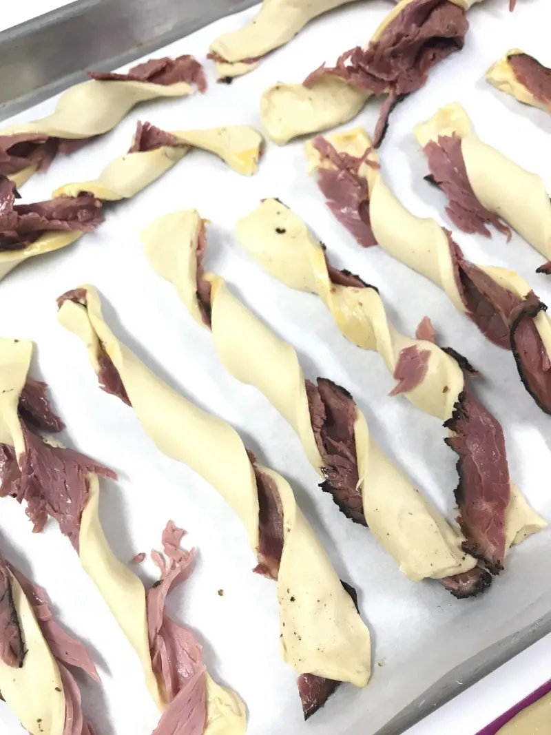 These sticky pastrami twists are delicious and addictive! They'll make a great addition to any meal, and everyone will want more of these sticky pastrami twists. #ShabbatMenu 