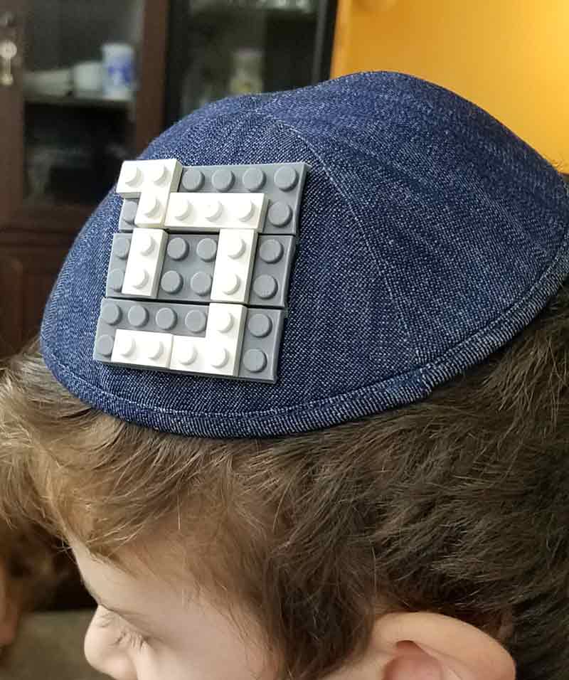This adorable LEGO Kippah is so easy to DIY and a fun yarmulke craft! It's a cool idea for an Upsherin or 3rd birthday party for Jewish boys and a great Judaica gift idea for kids. #judaica #kippah #beyondthebalagan