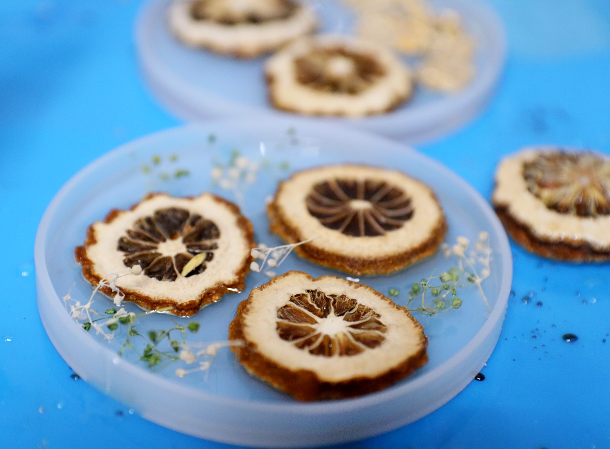 adding small floral embellishments to the resin 