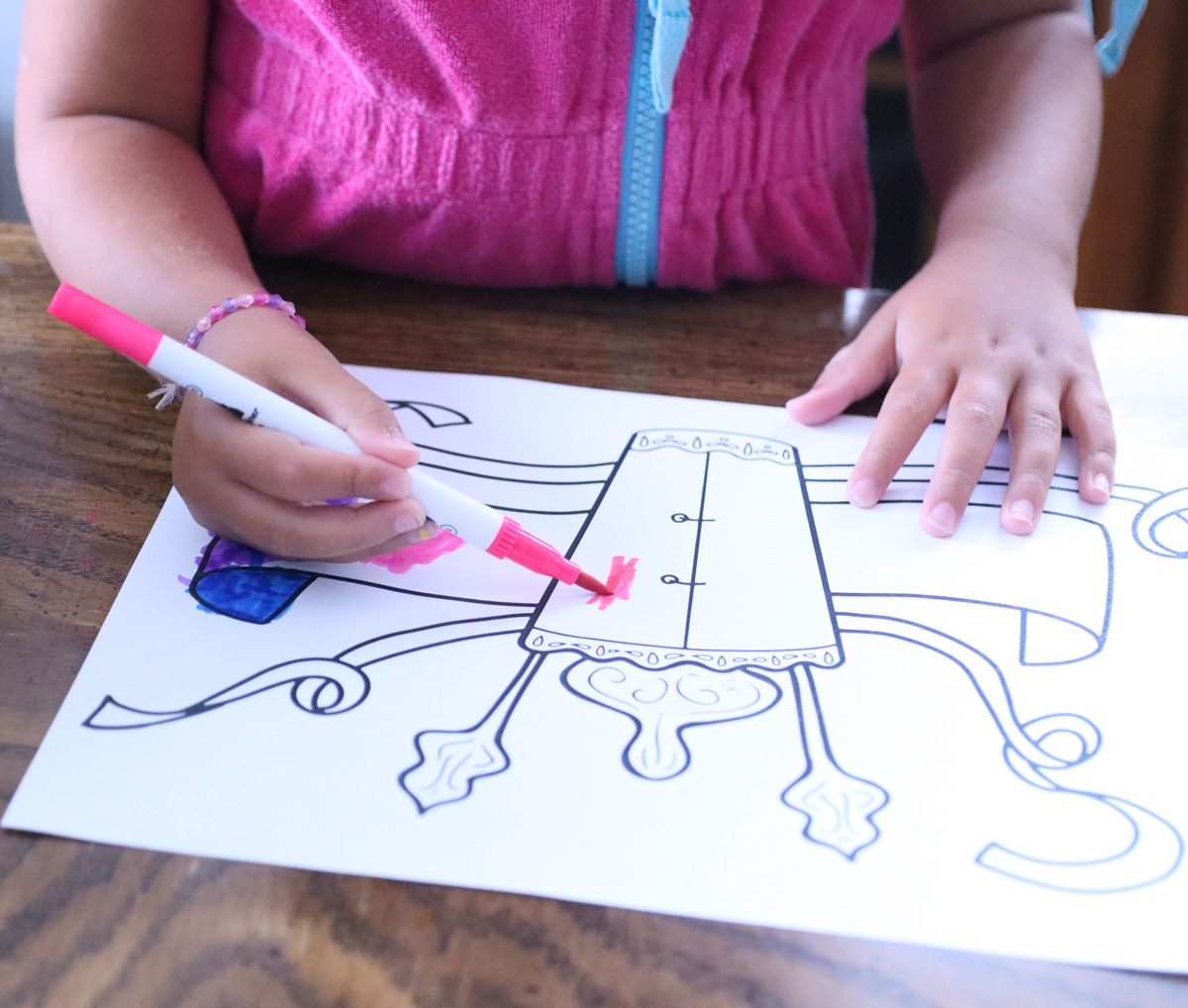 child coloring in the printable simchat torah flags craft