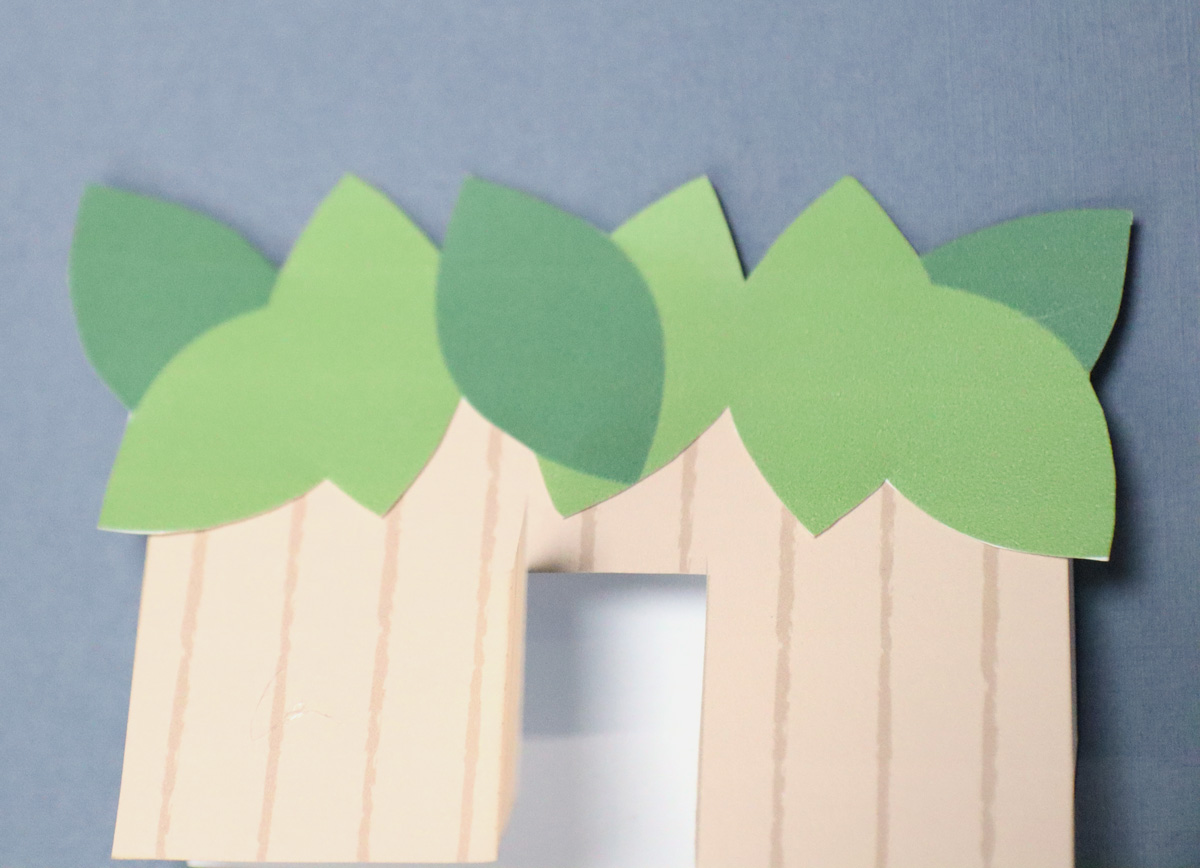 adding the leaves to the printable first Sukkah name cards