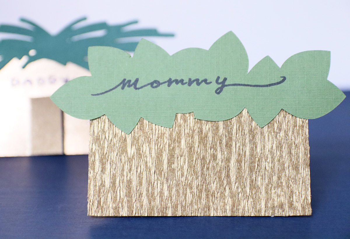 gluing the leaves to the cricut version printable Sukkah name cards